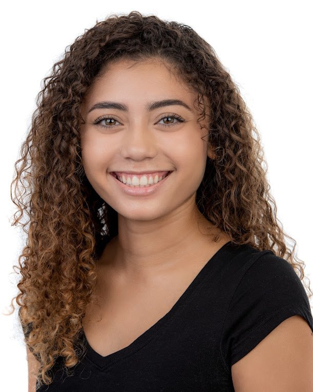 Professional headshot — woman with curls